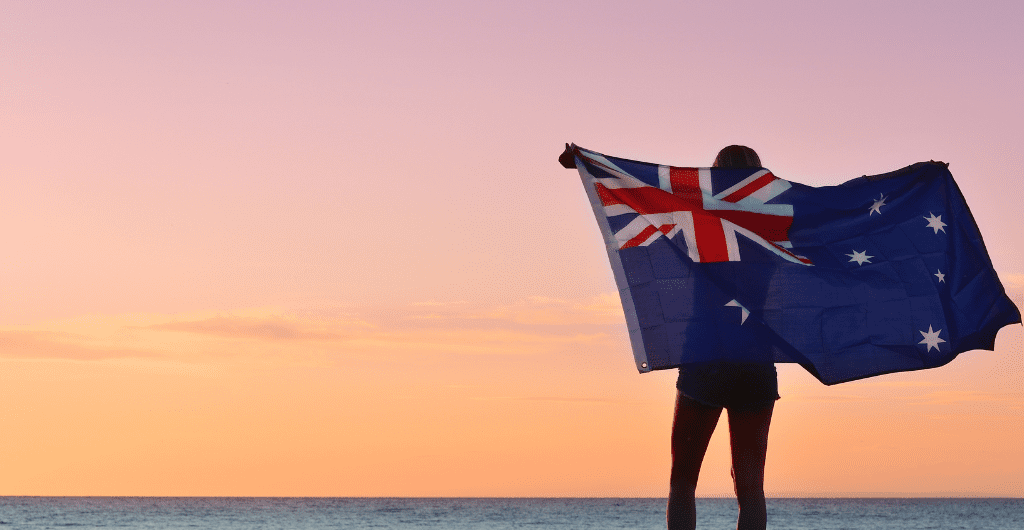 Australian flag, evening summer light on a beach
