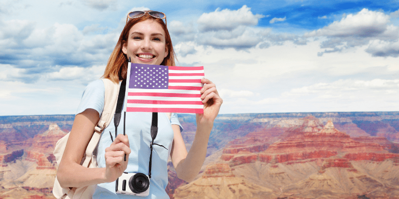 Happy woman mountain traveler with backpack enjoy view in Grand Canyon